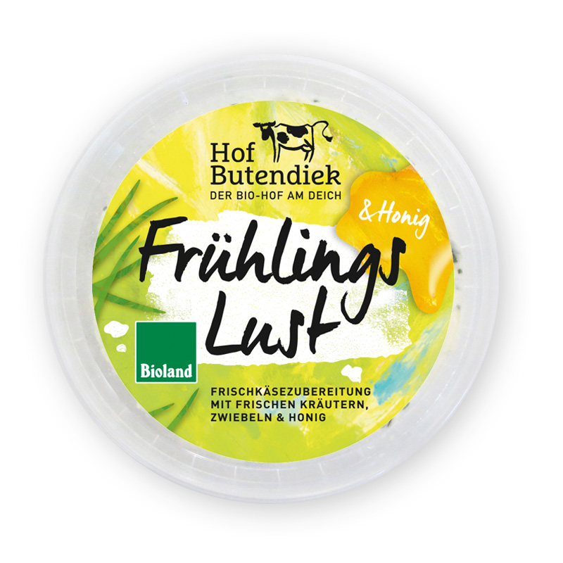 sorte-fruehlingslust-becher-offen Frühlingslust: Frischkäsebecher von oben mit grün-gelbem Etikett, Titel und Logo vom Hof